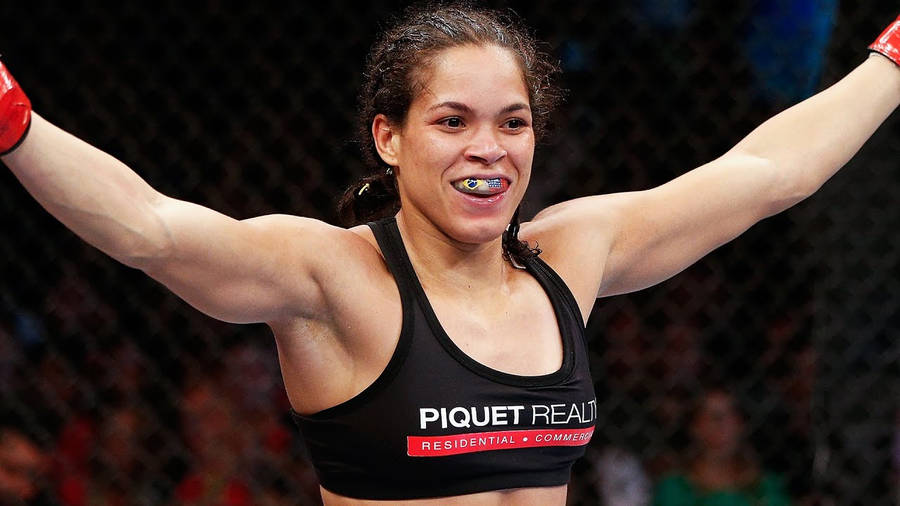 Amanda Nunes Arms Up Wallpaper