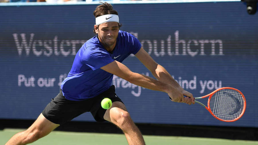 American Tennis Prodigy, Taylor Fritz In Action Wallpaper