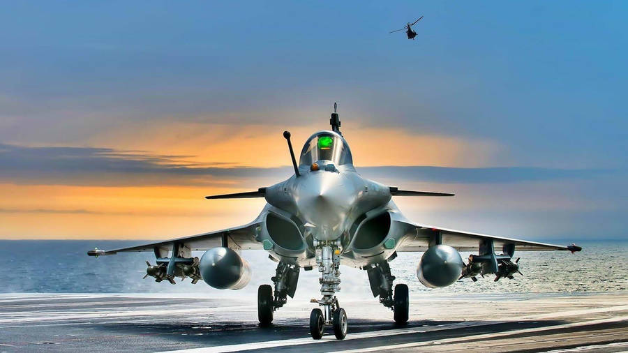 An Aerial View Of A Jet Flying Through The Skies Wallpaper