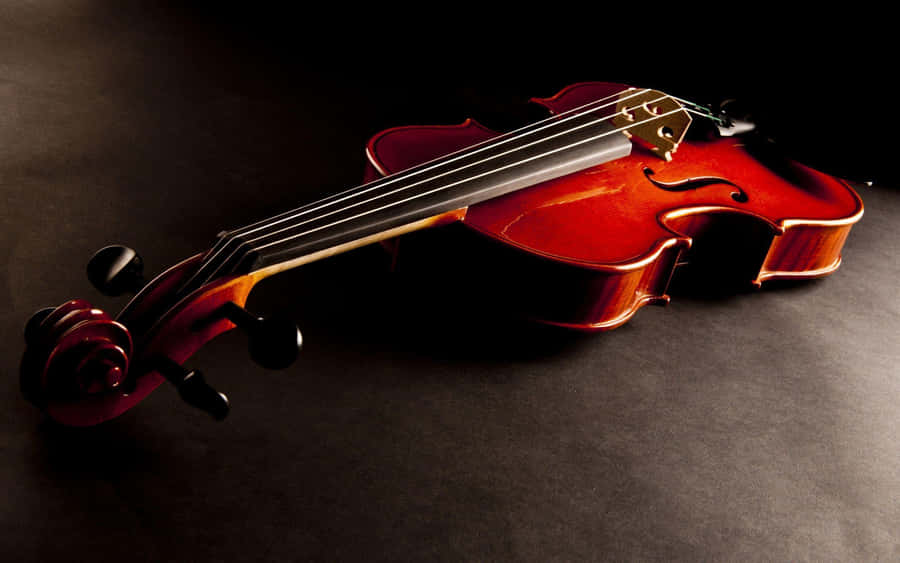 An Artist Performing At Their Utmost Potential With A Painted Violin Masterpiece. Wallpaper