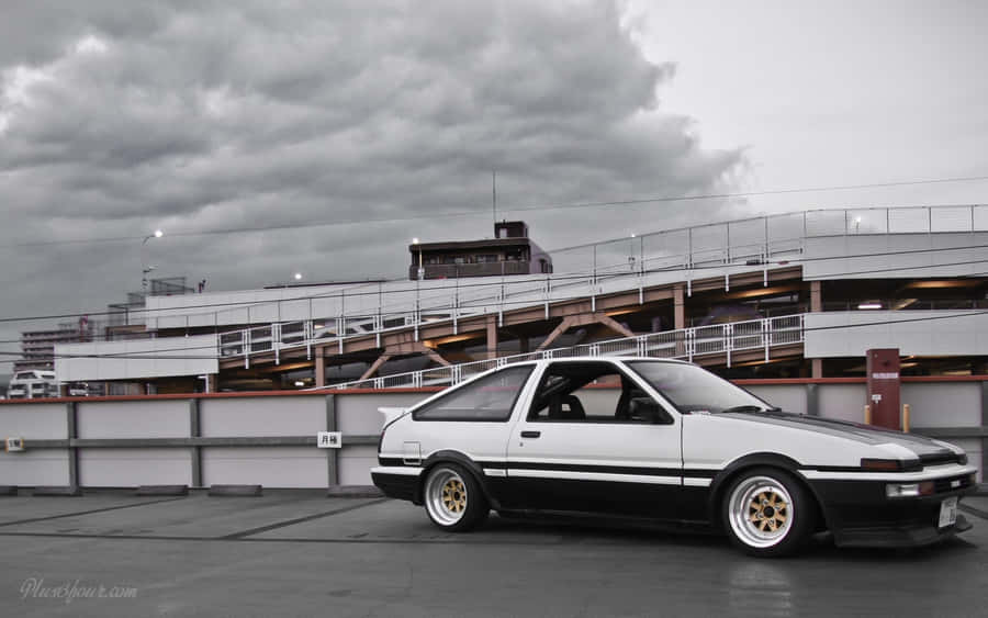 An Iconic Toyota Ae86 Framed Against A Beautiful Skyline Wallpaper