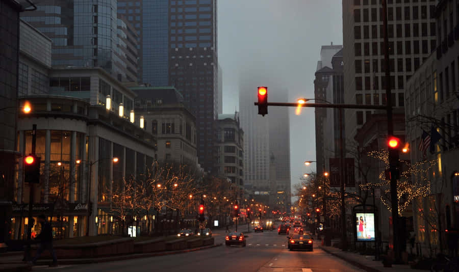 An Illuminated City Street In The Evening Wallpaper