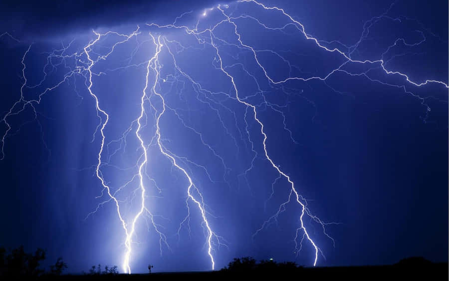 An Intense Thunderstorm With Brilliant Blue Lightning. Wallpaper