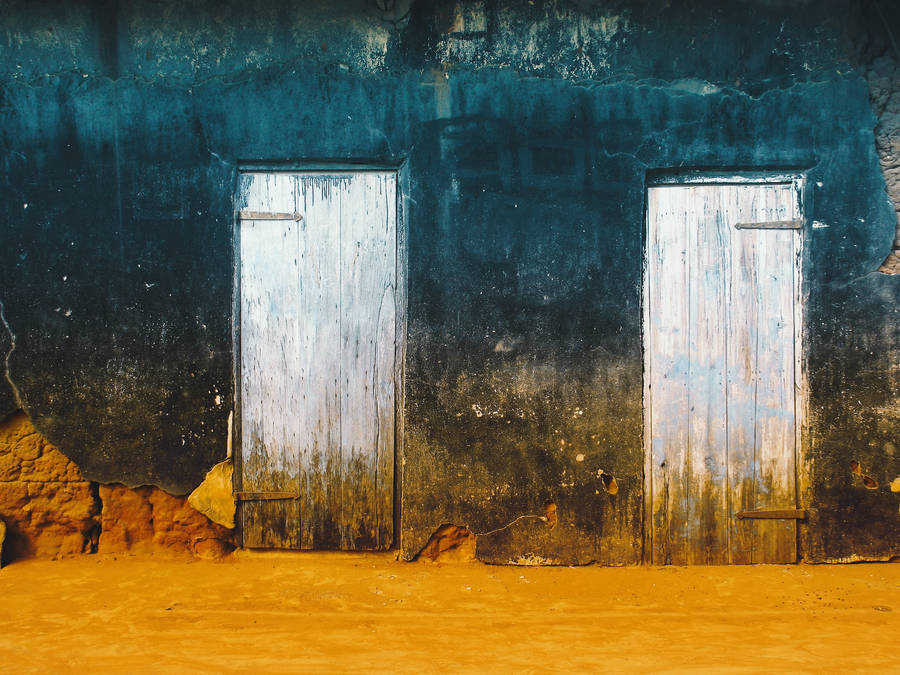 Ancient Wooden Doors In The Desert Wallpaper