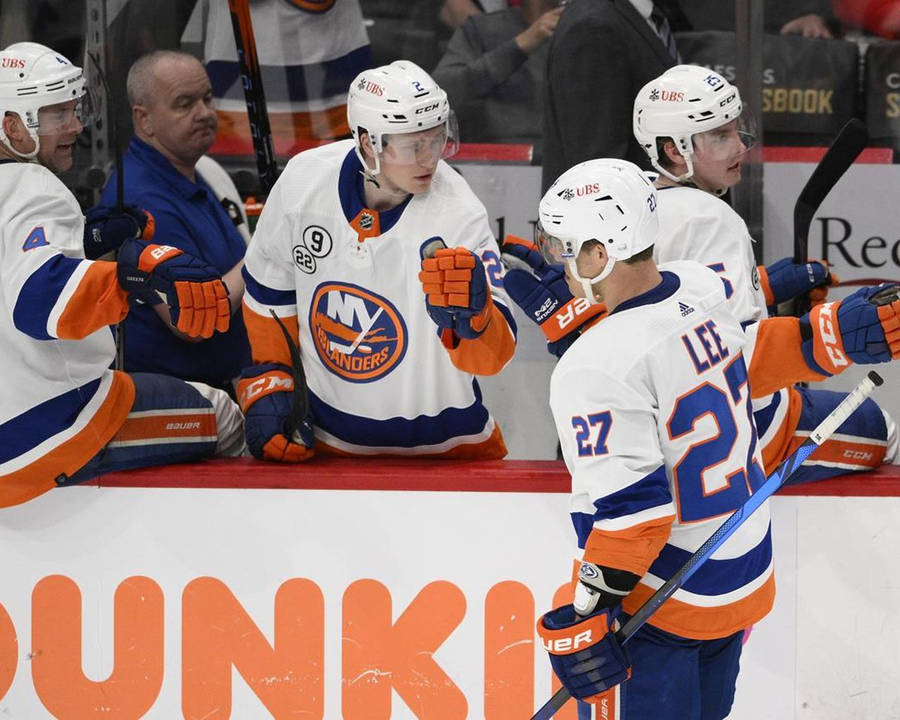 Anders Lee, An Influential Hockey Player, Sharing A Moment With His Bench Teammates. Wallpaper