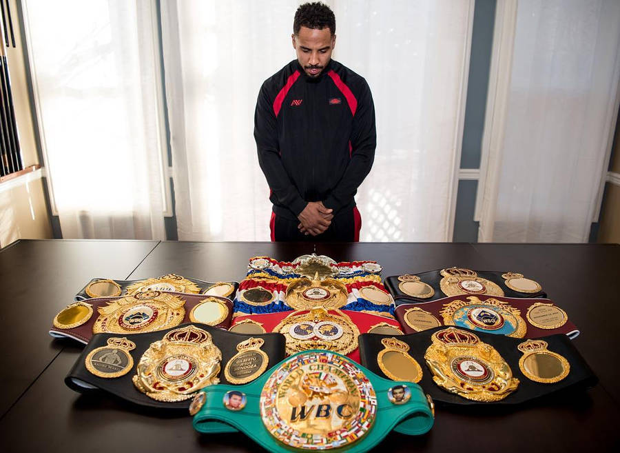 Andre Ward Looking At His Title Belts Wallpaper