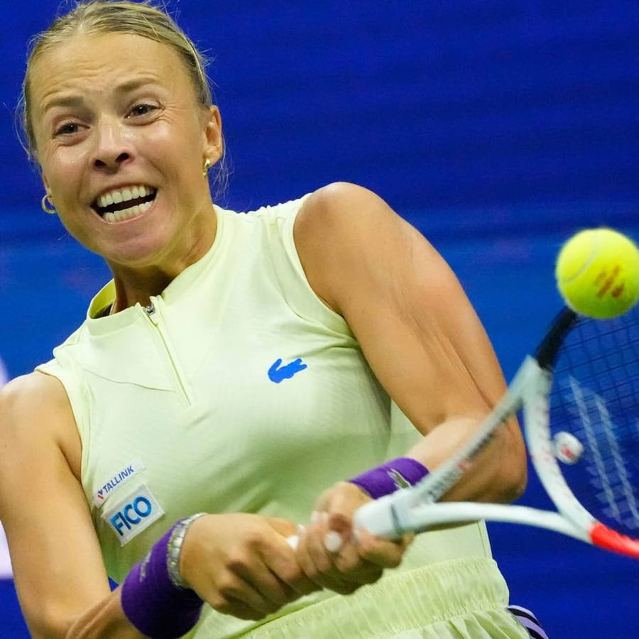 Anett Kontaveit In Action During A Tennis Match Wallpaper