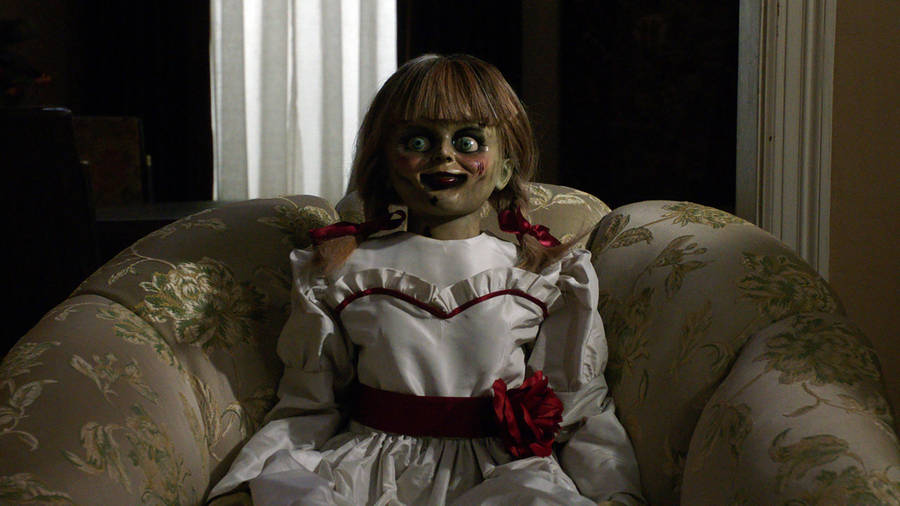 Annabelle Doll On Sofa Wallpaper