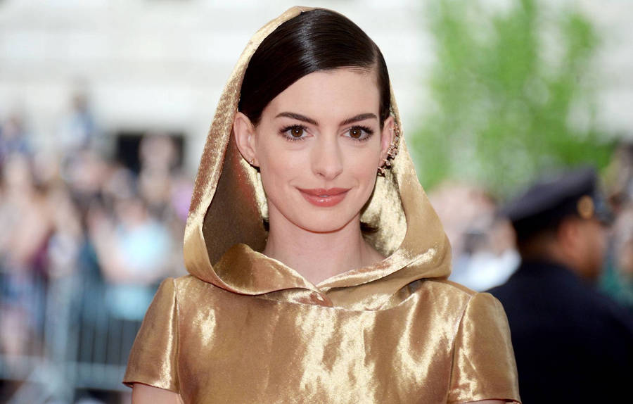 Anne Hathaway In Golden Robe Wallpaper