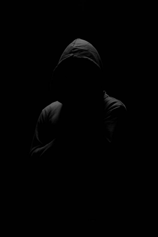 Anonymous Man In Pitch Black Background Wallpaper