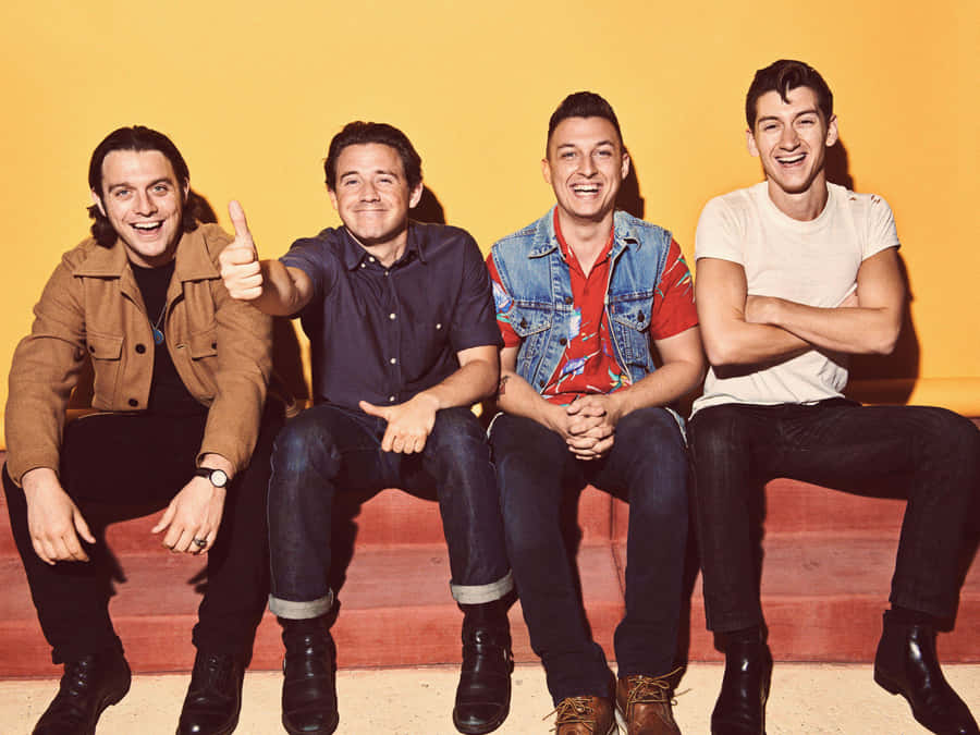 Arctic Monkeys Band Portrait_ Yellow Background Wallpaper