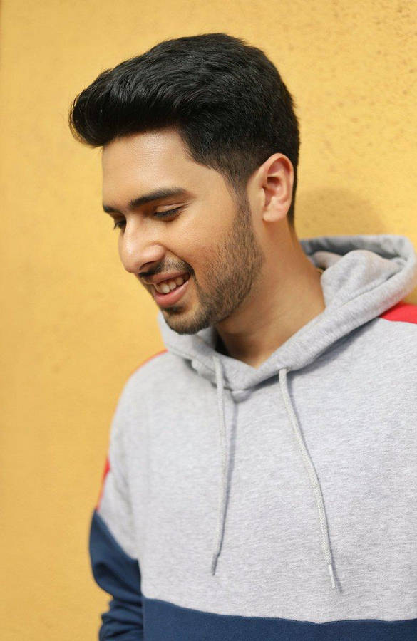 Armaan Malik Striking A Thoughtful Pose Wallpaper