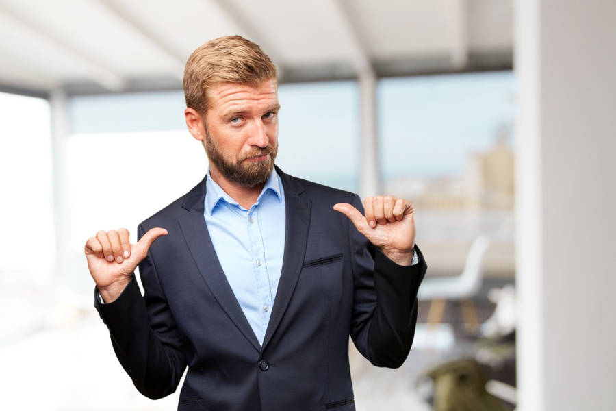 Arrogant Man With Thumbs Pointing To Self Wallpaper