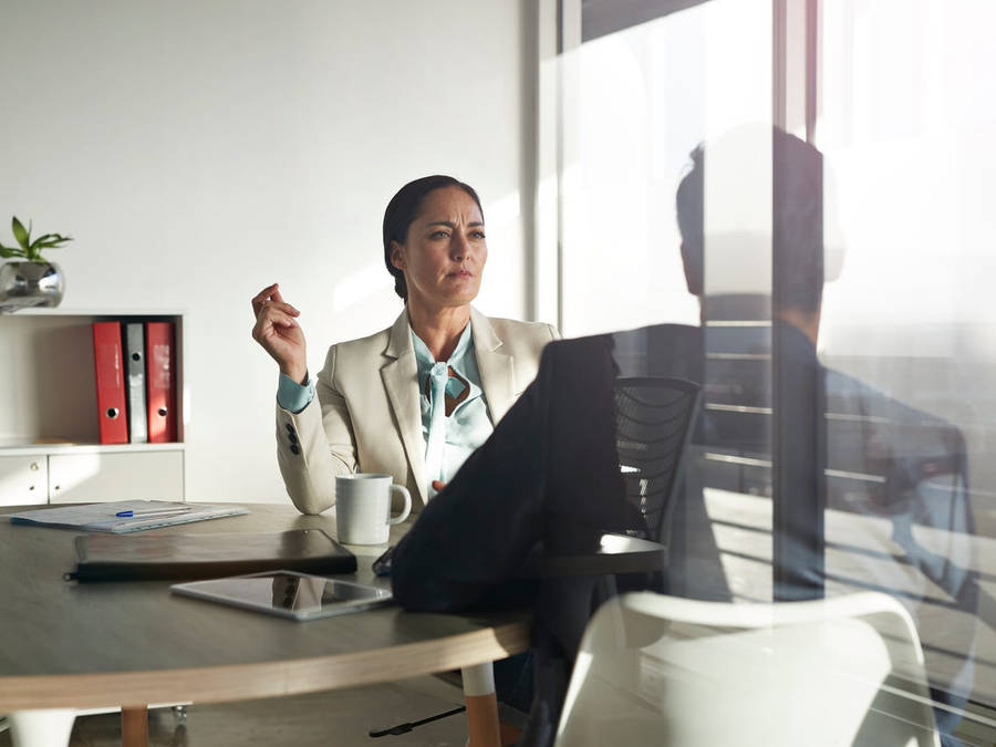 Arrogant Woman Listening To Colleague Wallpaper