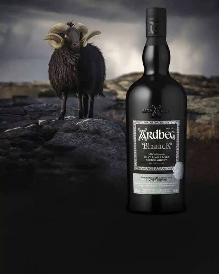 Artful Ardbeg Blaaack Whisky Bottle Displayed With A Black Sheep Wallpaper