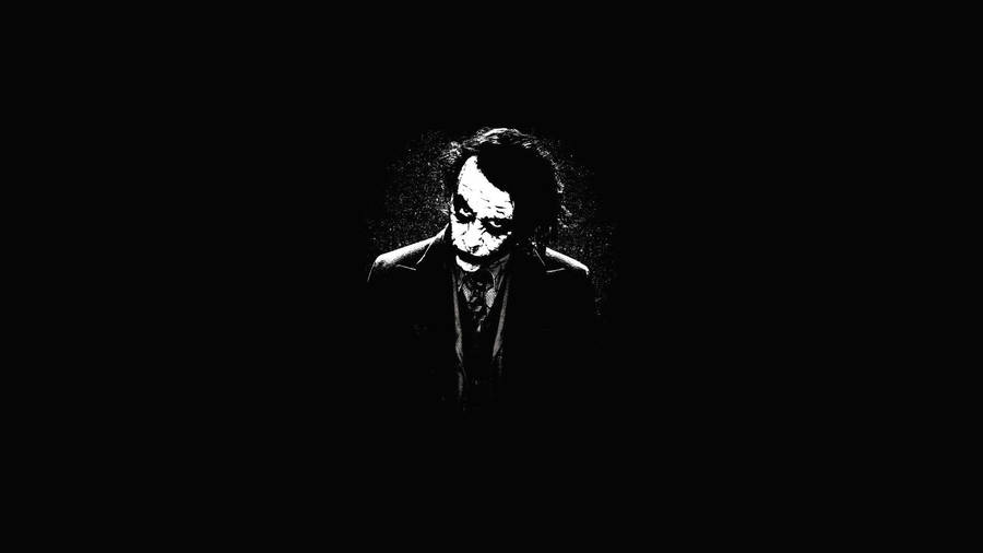 Arthur “joker” Fleck Captured Over Dark Screen Wallpaper