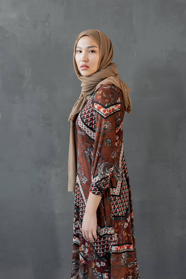 Asian Woman Wearing Stylish Brown Hijab Wallpaper
