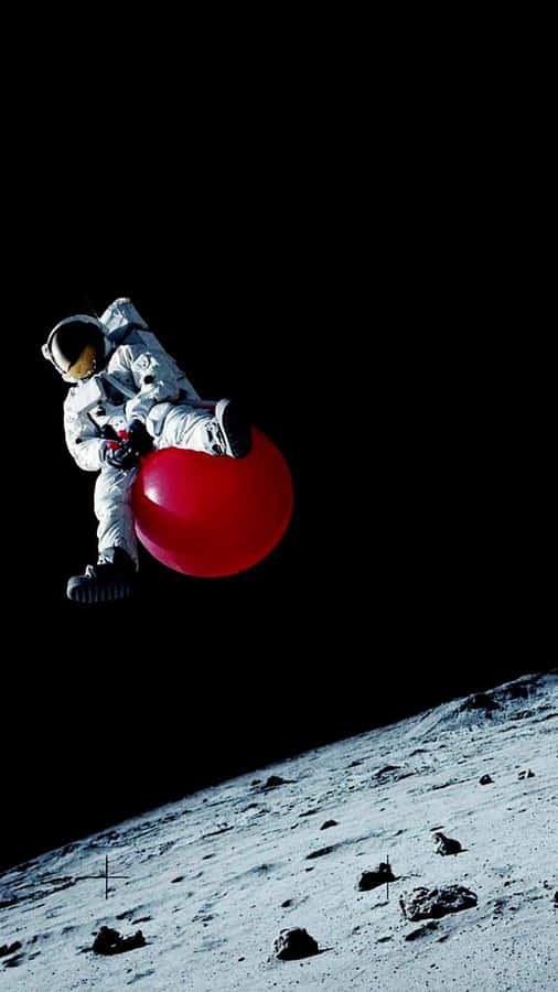 Astronaut Bouncingon Red Ball Moon Wallpaper