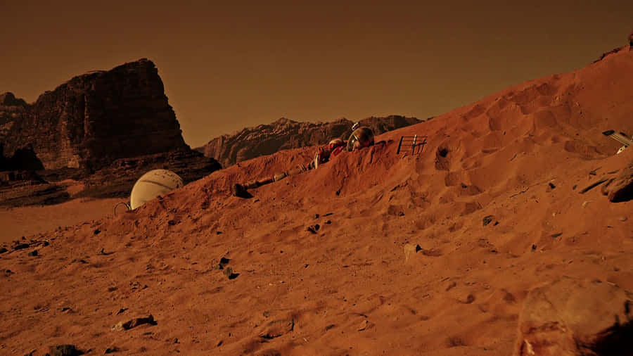 Astronaut Mark Watney Standing On Mars In A Still From The Movie 'the Martian'. Wallpaper