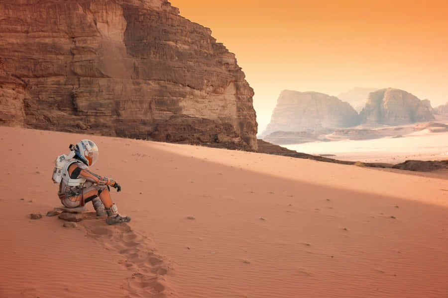 Astronaut Standing In Vast Mars Landscape Wallpaper