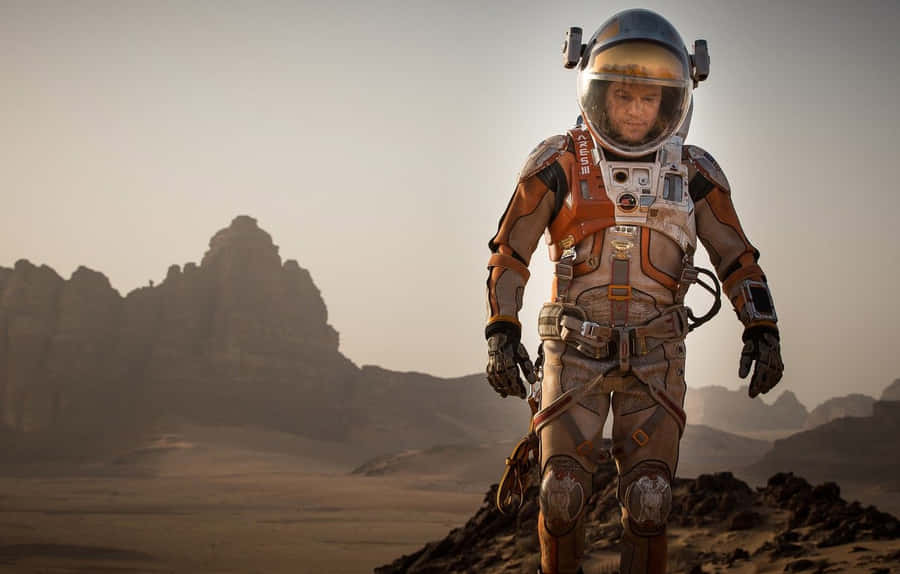 Astronaut Standing On The Mars Surface During A Mission In The Martian Movie Wallpaper