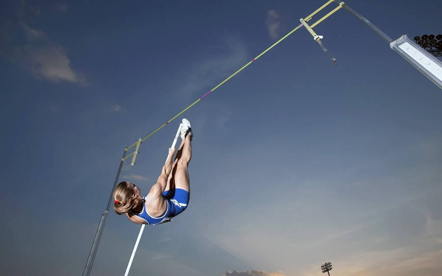 Athletic Pole Vaulter Jump Wallpaper