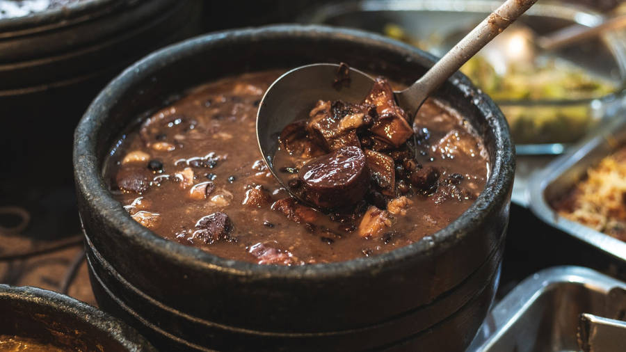 Authentic Brazilian Feijoada With Crispy Farofa Topping Wallpaper