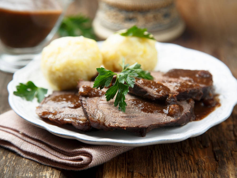 Authentic German Sauerbraten With Potato Dumplings Wallpaper