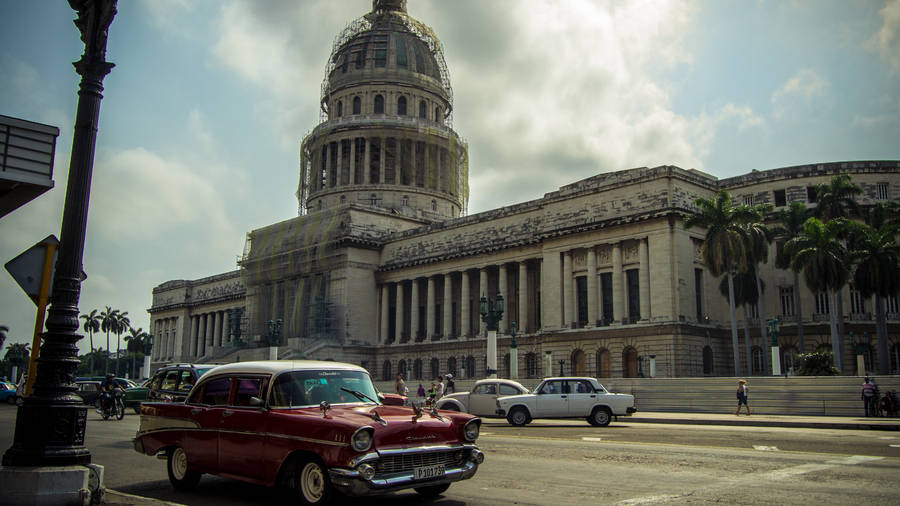 Authentic Havana With Classic Cars And El Capitolio Wallpaper