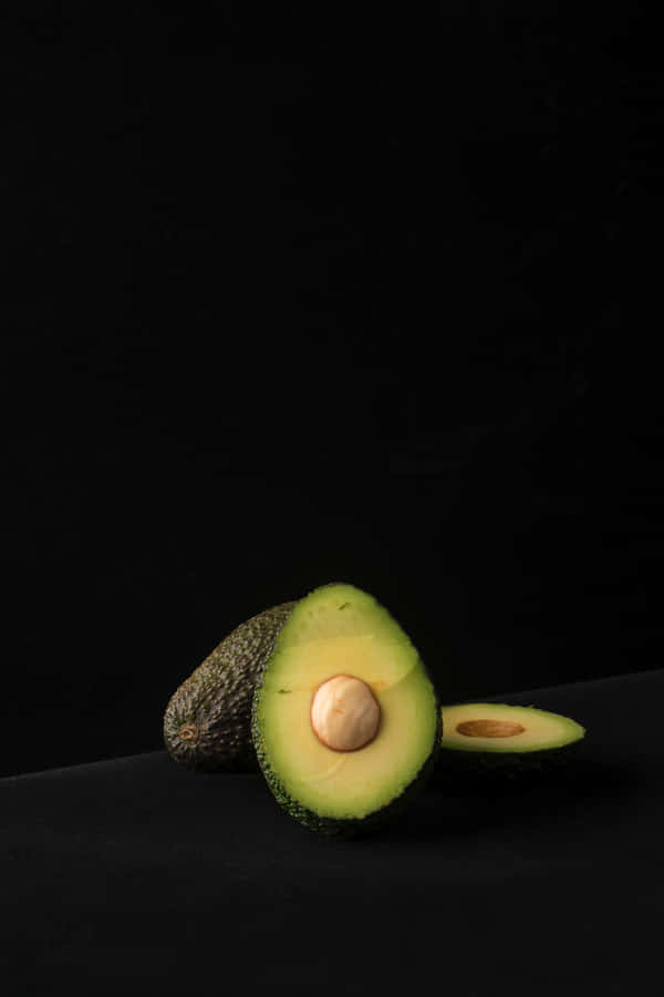 Avocado Iphone In A Dark Room Wallpaper