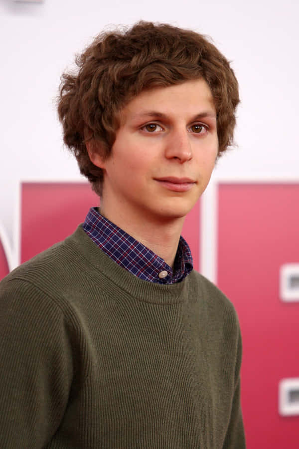 Award-winning Actor Michael Cera Posing For A Professional Photoshoot. Wallpaper