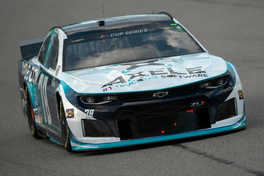 B.j. Mcleod Behind The Wheel Of His Light Blue Nascar Race Car. Wallpaper