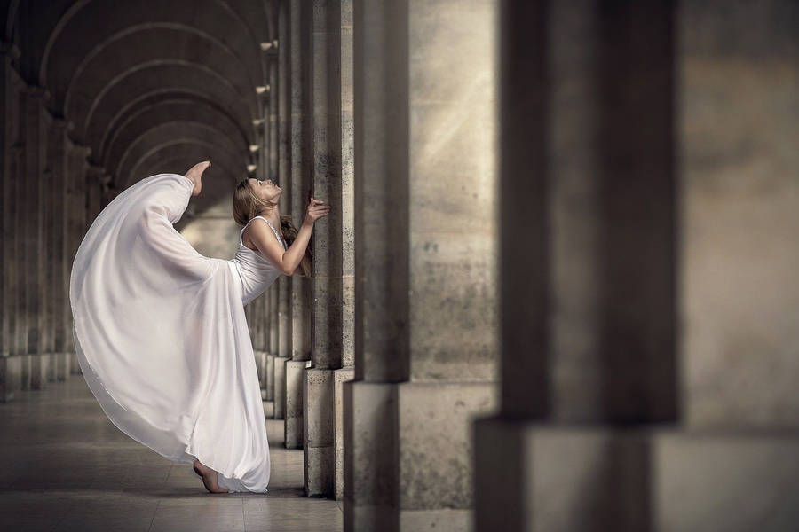 Ballet Dancer Leaning On Pillar Wallpaper