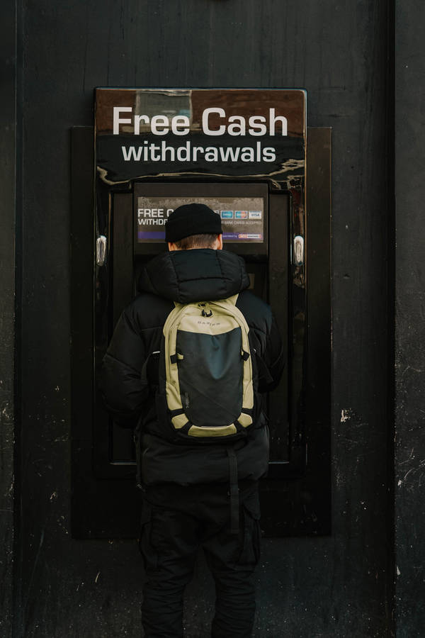 Bank Man In Atm Machine Wallpaper