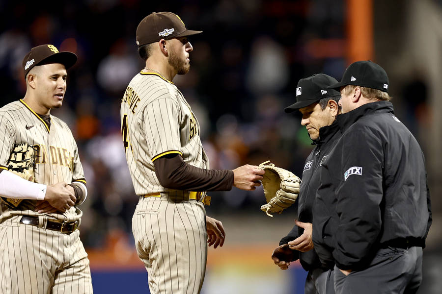 Baseball Pitcher Joe Musgrove With Three Men Wallpaper