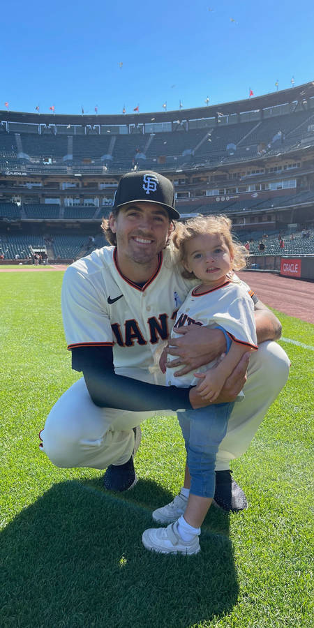 Baseballer Kevin Gausman With Lovely Daughter Wallpaper