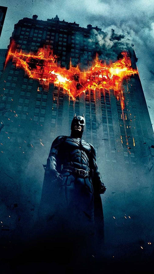 Batman In Front A Flaming Building Iphone X Wallpaper