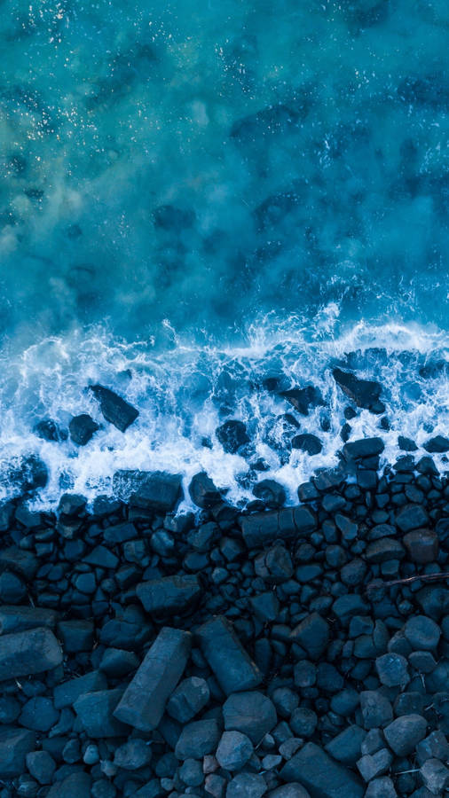 Beach Wave Iphone Foaming On Rocks Wallpaper