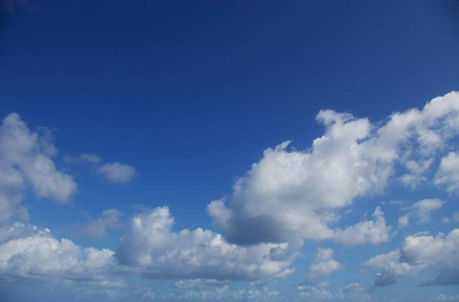 Beautiful Blue Cloud-filled Sky Wallpaper