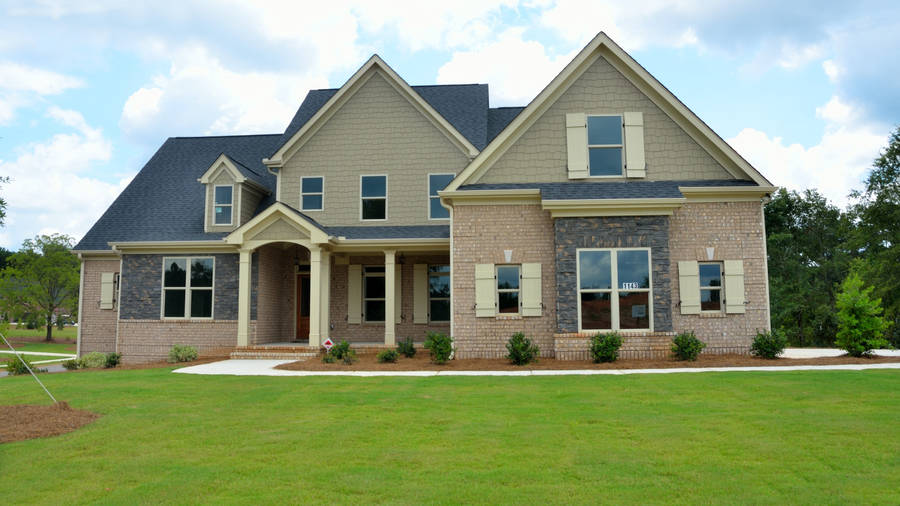 Beautiful House With Green Grass Wallpaper