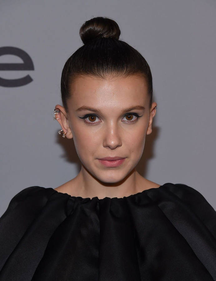 Beautiful Millie Bobby Brown In Black Dress Wallpaper