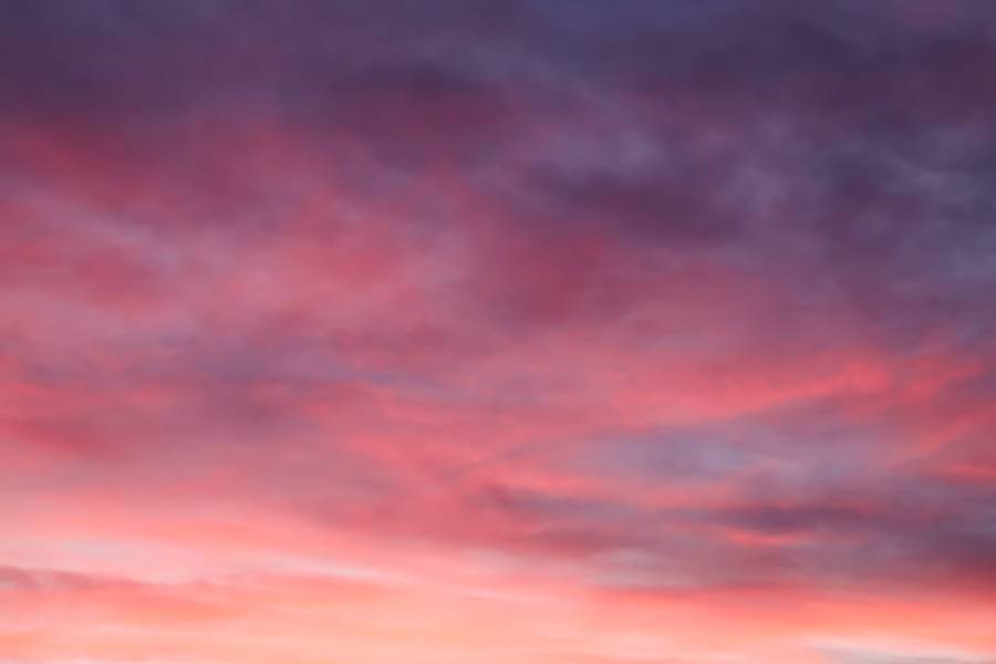 'beautiful Pink And Gray Ombre Clouds Against A Clear Sky' Wallpaper