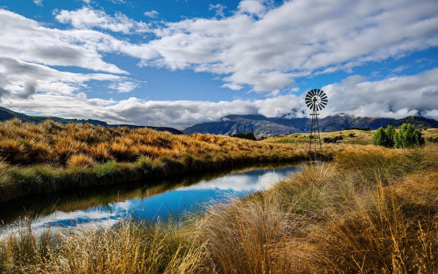 Beautiful Sky Over Calm Creek Wallpaper