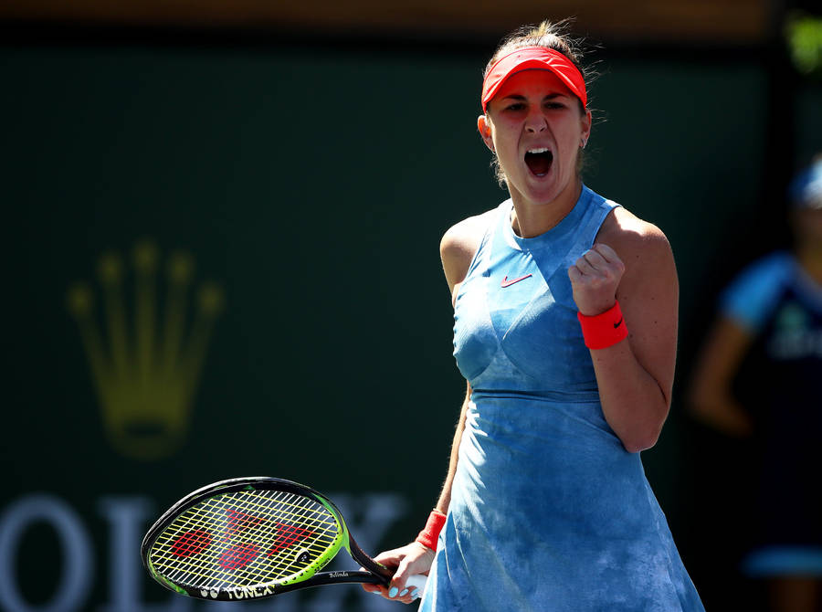 Belinda Bencic Celebrates A Win In Her Signature Blue Attire Wallpaper