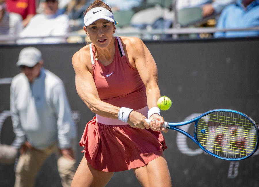 Belinda Bencic Showcasing Her Strength In A Professional Tennis Match Wallpaper