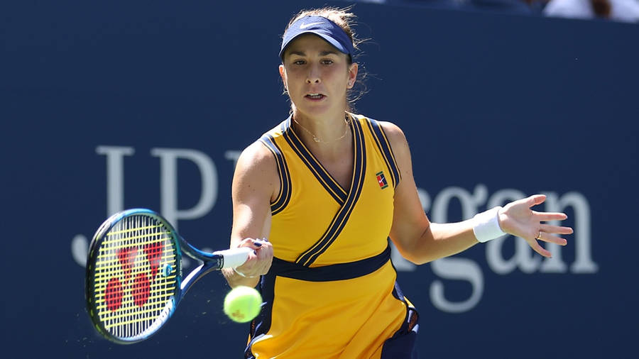 Belinda Bencic Skillfully Receives A Tennis Ball During A Match. Wallpaper