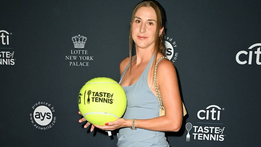 Belinda Bencic With Large Tennis Ball Wallpaper