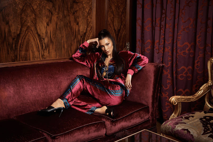 Bella Hadid Sitting Velvet Couch Wallpaper