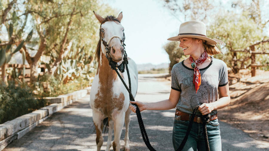 Beth Behrs With A Horse Wallpaper