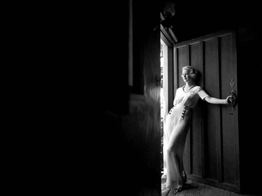 Bette Davis Posing In A Door Wallpaper